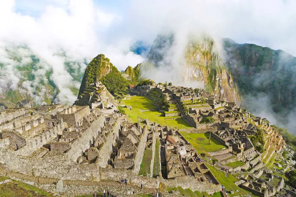 Machu Picchu ruins with Huayna Picchu mountain on the background