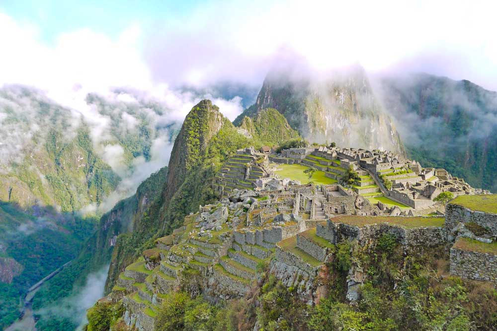 Machu Picchu ruins with Huaynapicchu Mountain on the background