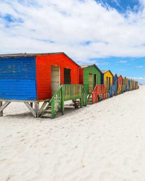 Colorful wooden beach cabins on Muizenberg beach in Cape Town