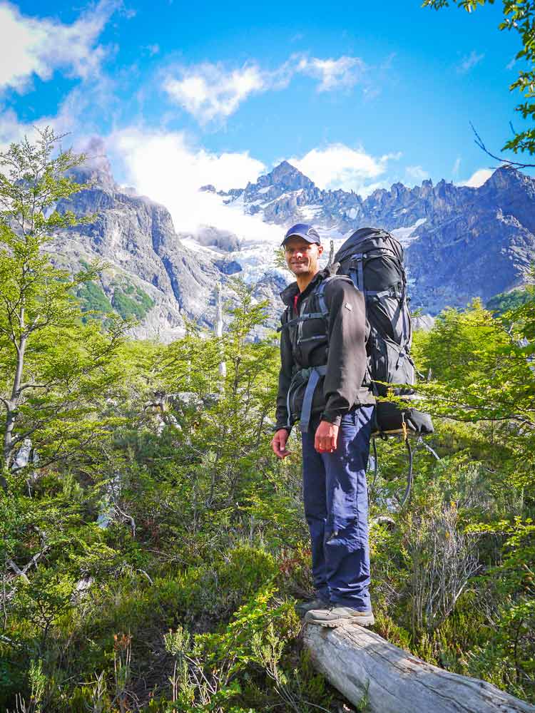 Campbell with his hiking gear in the forest in Cerro Castillo Park, Chile