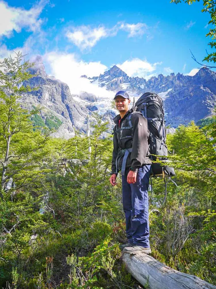 Campbell with his hiking gear in the forest in Cerro Castillo Park, Chile
