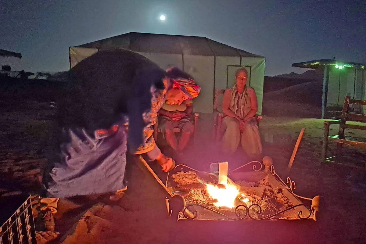 berber making camp fire in the desert