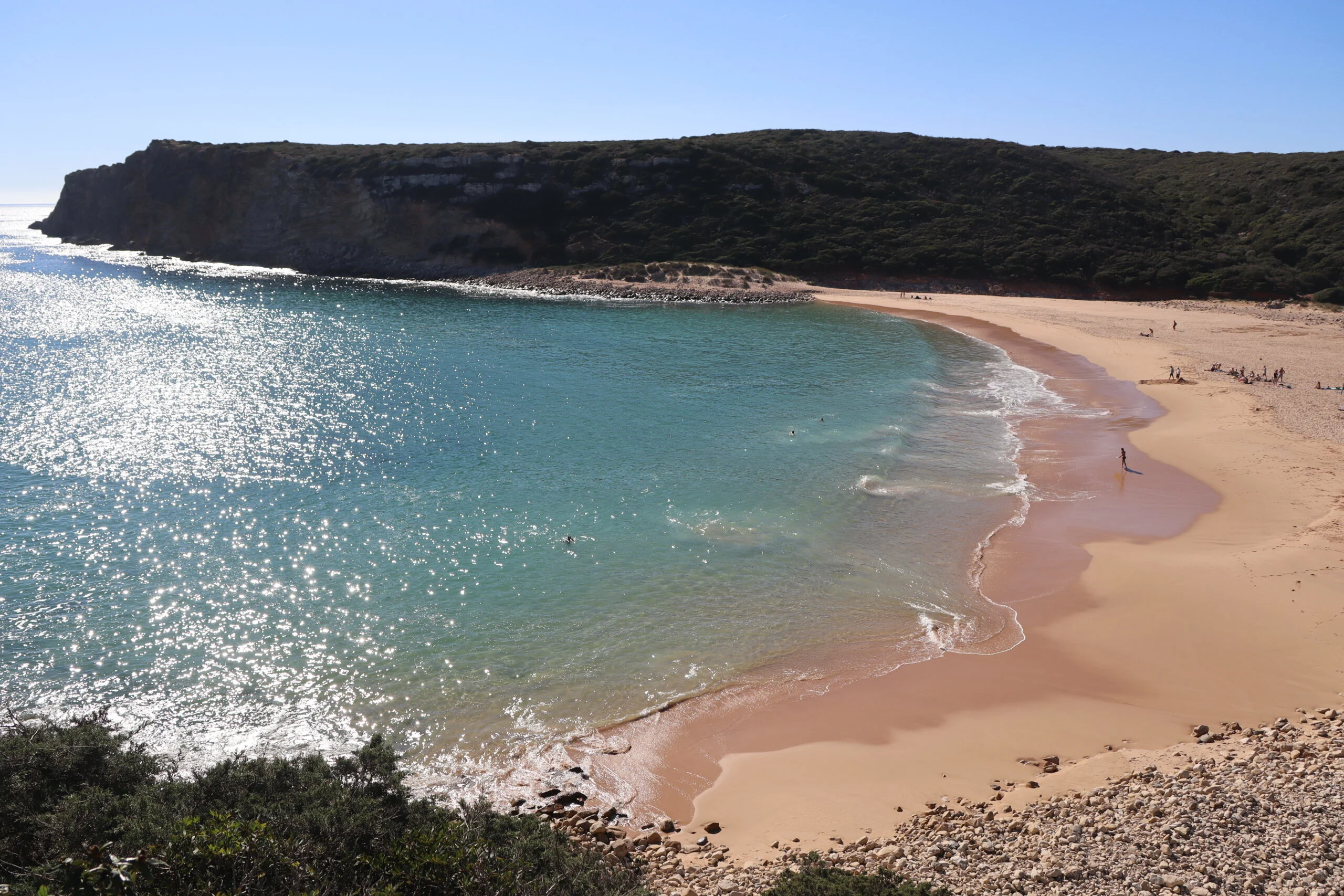 empty sandy beach with blue water