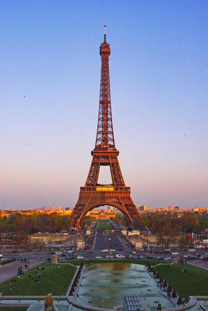 A view of the Eiffel Tower at the sunset