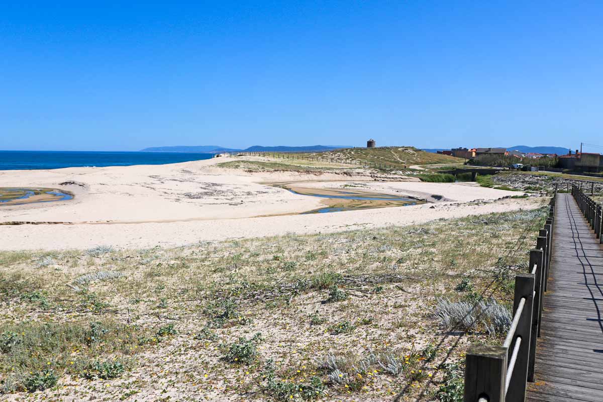 A wide beach with a boardwalk on the Litoral Way to Esposende