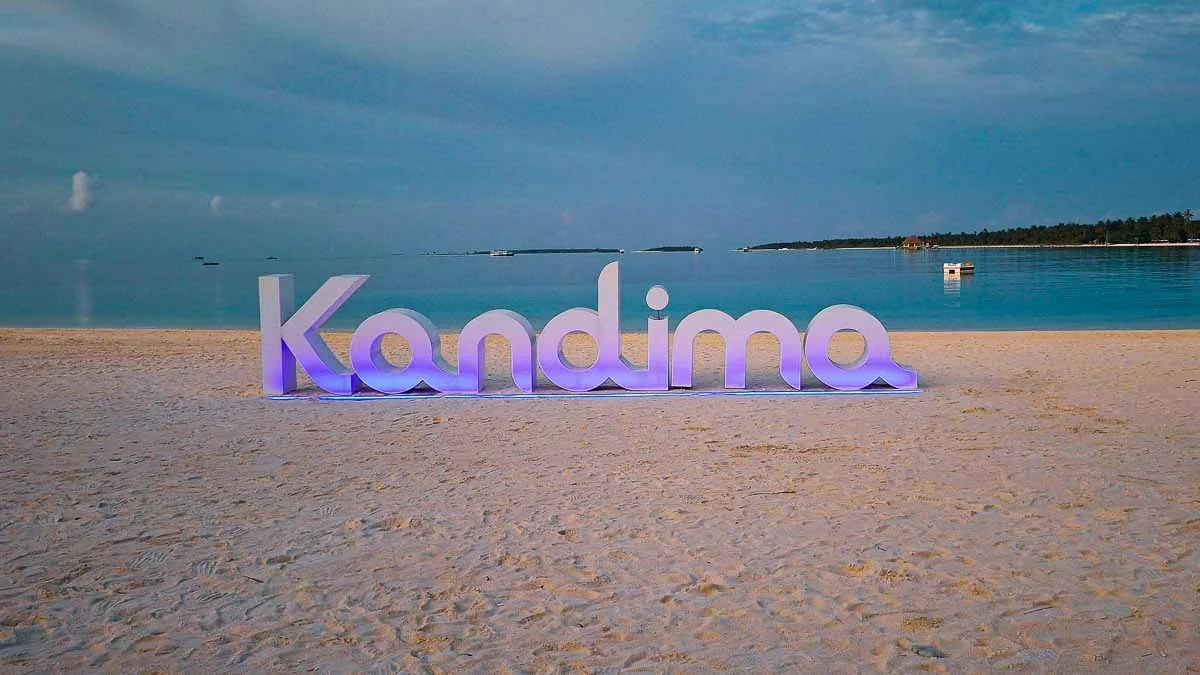 kandima sign on the beach at night time