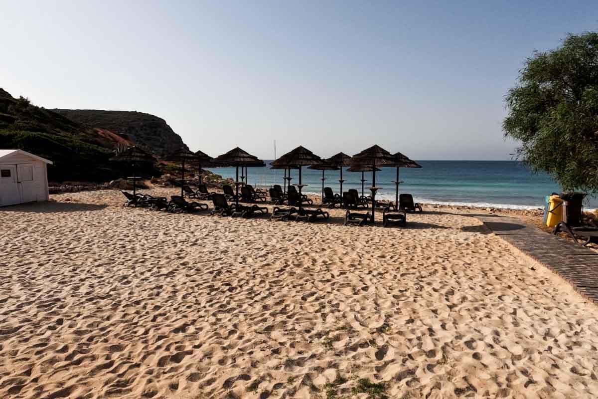 small beach with umbrellas