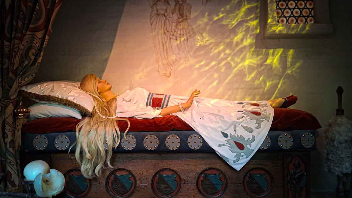 sleeping lady with blond hair on a bed