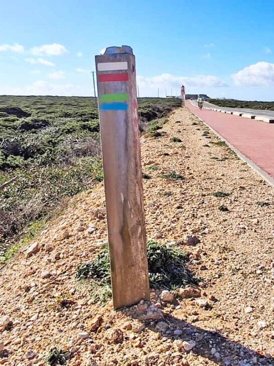 pole with red and white stripe and blue and green stripe markers