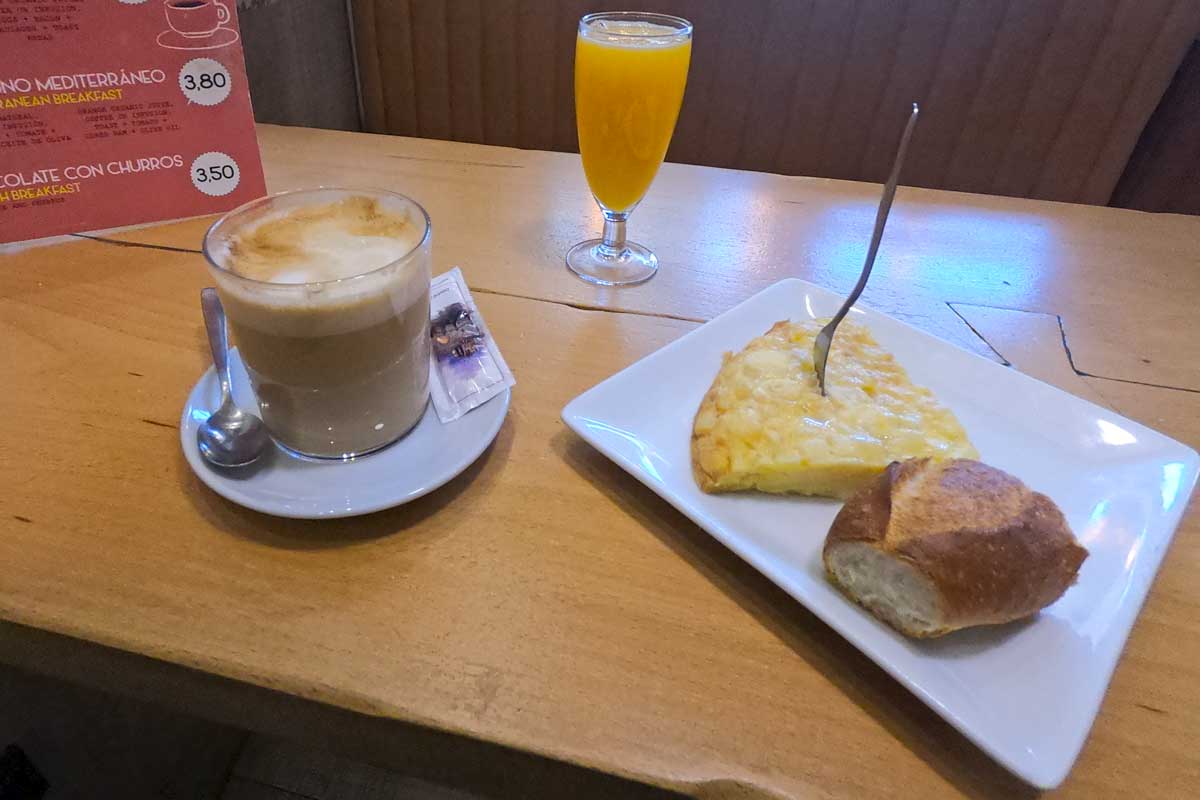 A typical Camino breakfast; coffee, orange juice, and tortilla with white bread