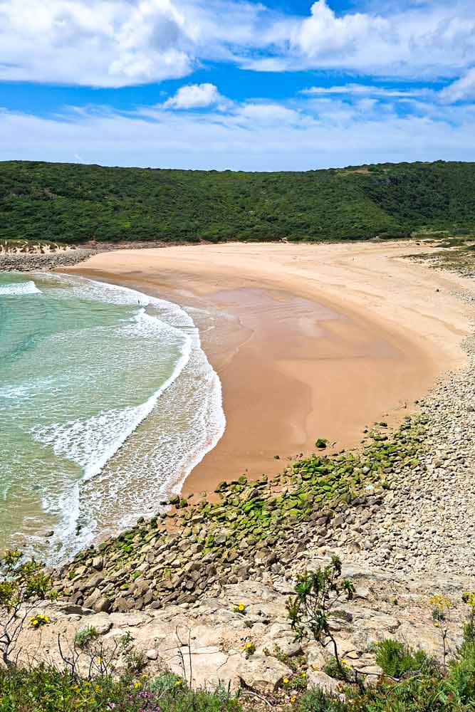 A wild scalloped-shaped beach on the trail near Sagres