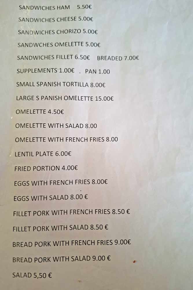 A menu with lunch options and prices in a local restaurant on the Camino Finisterre-Muxia route