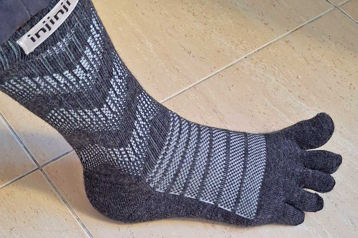 injinji merino wool socks on the foot of a hiker
