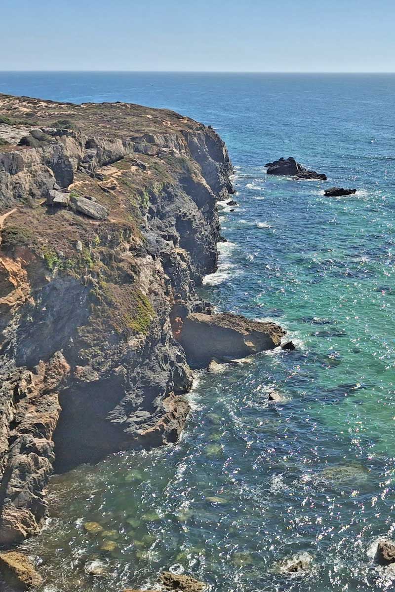 cliffs dropping into crystal clear ocean