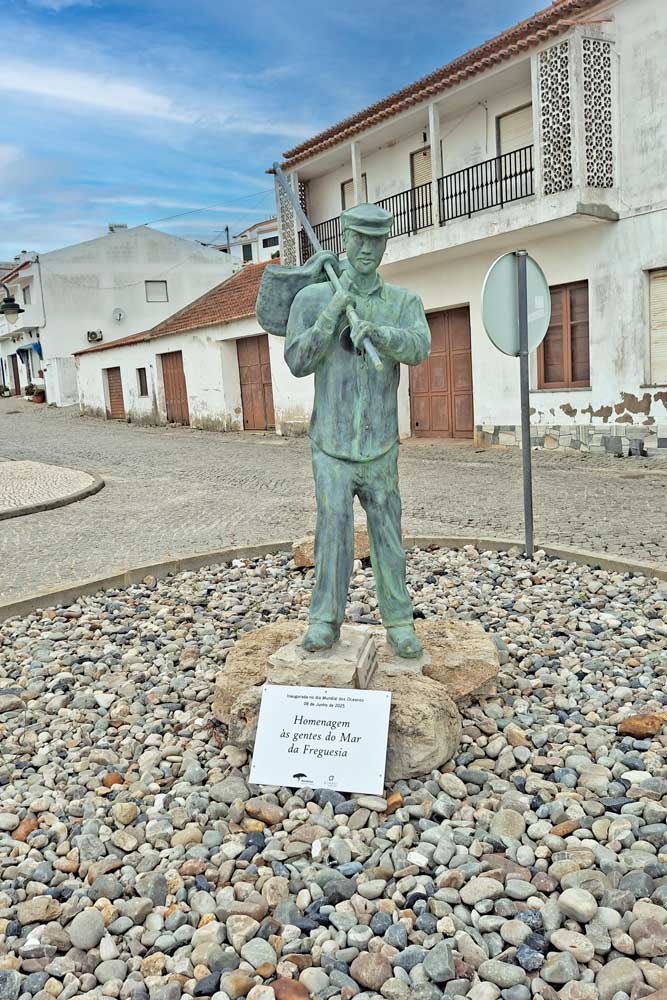 bronze statue of a fisherman