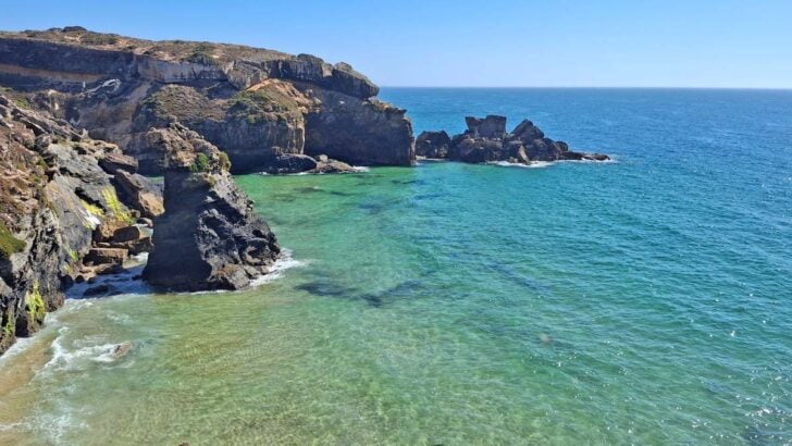 cliffs dropping into crystal clear ocean