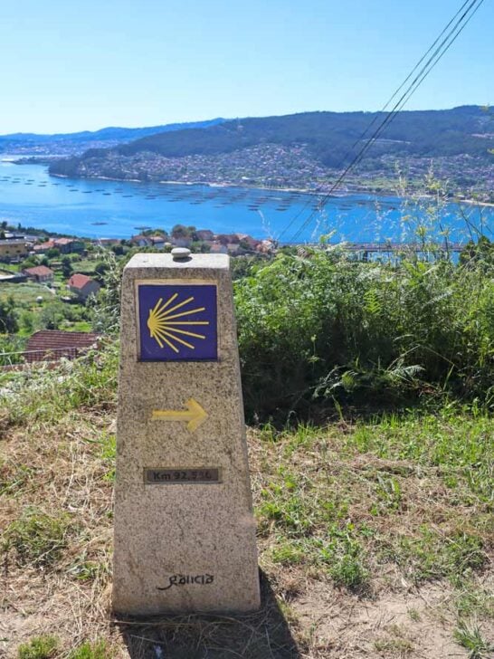 A stone Camino sign on the route near Vigo