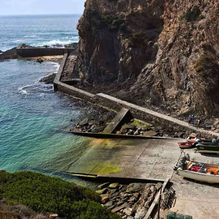 nice harbor below the cliffs with small boats