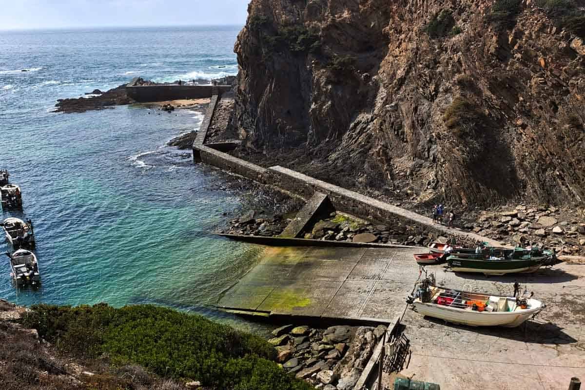 nice harbor below the cliffs with small boats